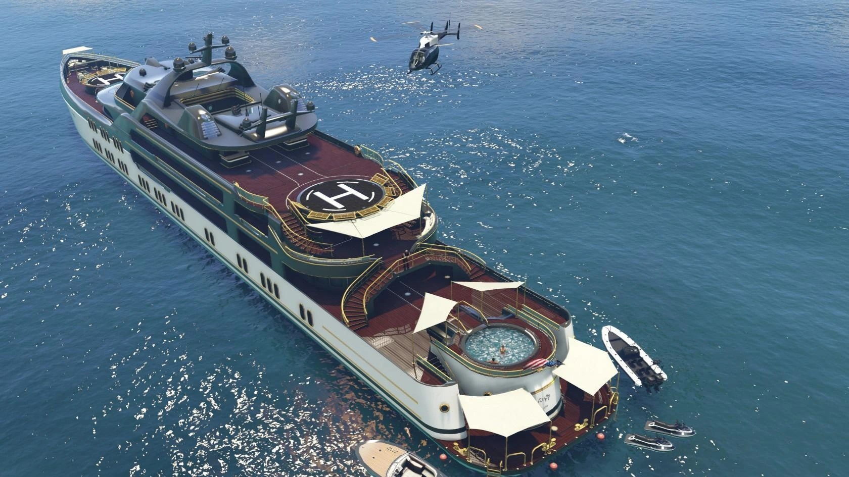A large managed yacht and support craft viewed from above on clear coastal water