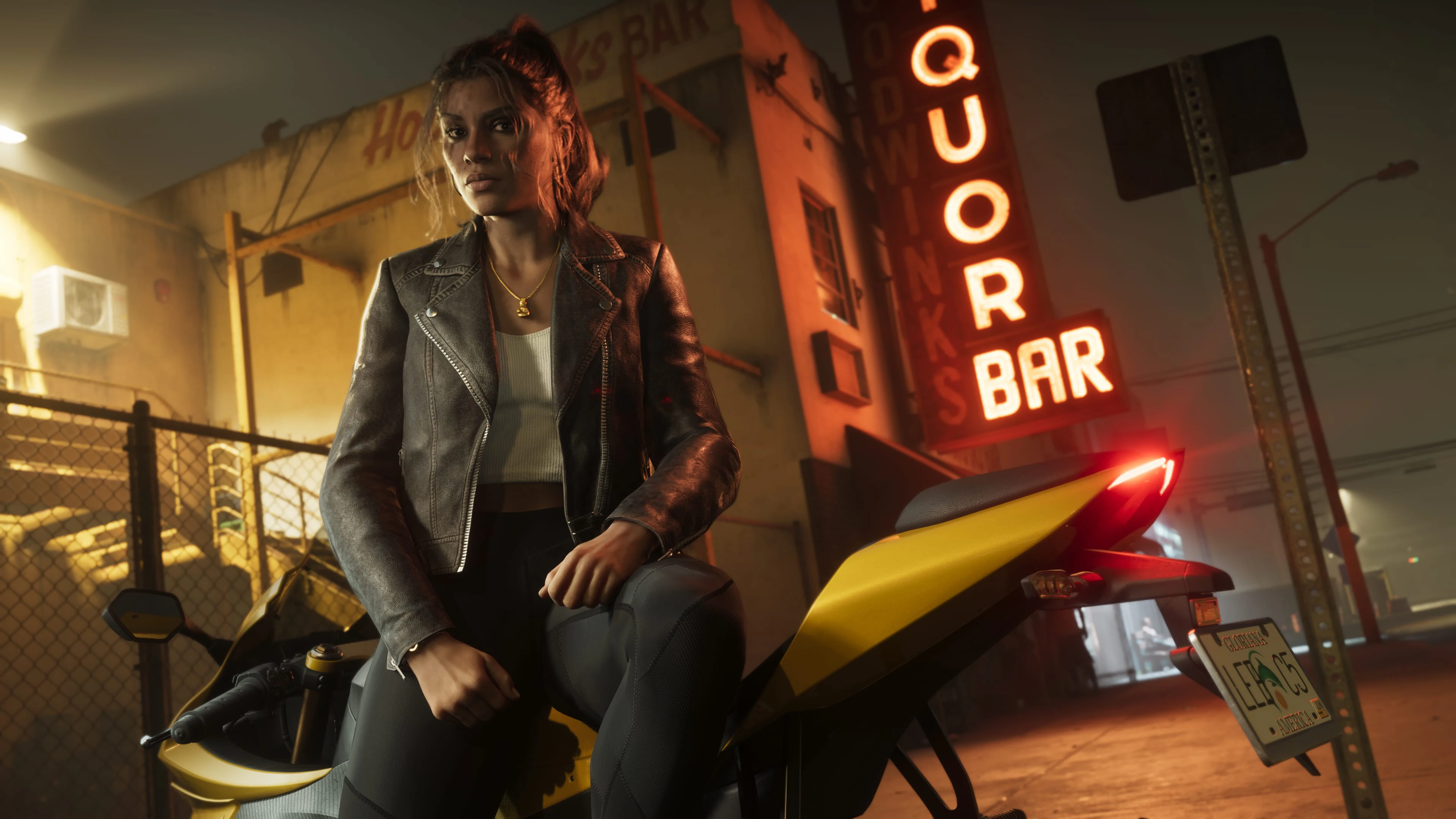 An adult woman in a leather jacket seated on a yellow motorcycle outside a neon bar